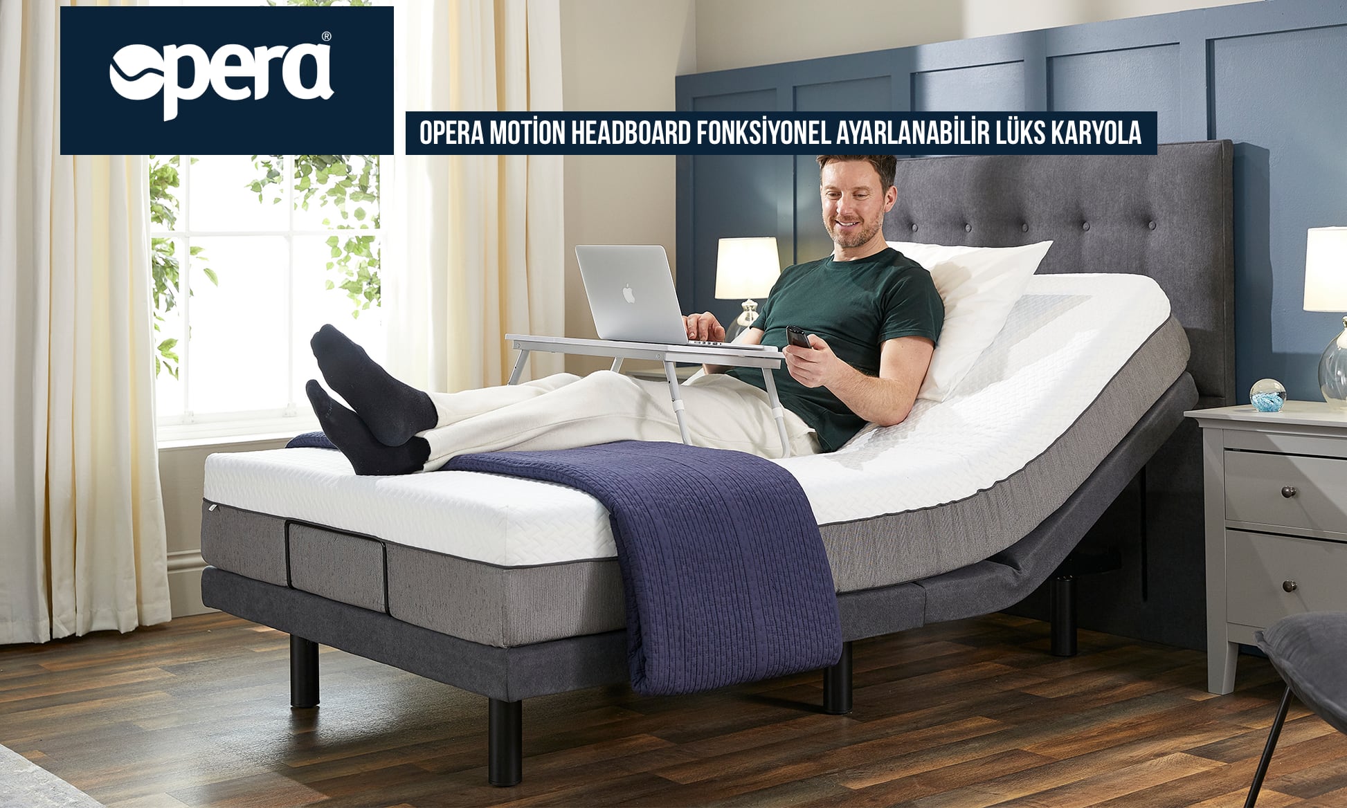 Ayarlanabilir Lüks Karyola Opera Motion Headboard Fonksiyonel dizüstü bilgisayar kullanan bir erkek